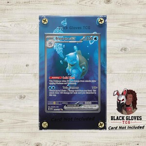 May include: A blue Blastoise EX Pokémon card in a clear protective case. The card features a blue turtle-like creature in an underwater scene. The case is secured with gold-colored screws. The text "Card Not Included" is visible.