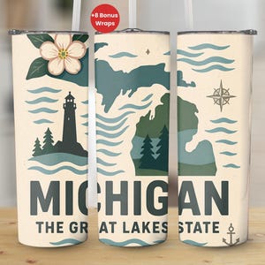 May include: A set of three insulated tumblers with a cream background. Each tumbler features a different design element related to Michigan, including a lighthouse, a map, and a compass. The text "MICHIGAN THE GREAT LAKES STATE" is displayed on the tumblers.