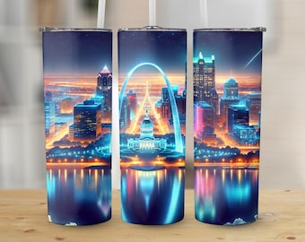 May include: A set of three stainless steel tumblers featuring a vibrant, neon-lit cityscape design. The artwork depicts a city skyline with a prominent arch, buildings, and a reflective body of water, all in shades of blue, orange, and pink.