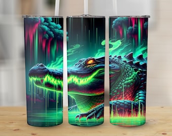 May include: A set of three stainless steel tumblers with a vibrant, neon-style illustration of an alligator. The design features a green and blue color scheme with glowing accents, creating a striking visual effect. The tumblers are designed to hold approximately 20 ounces of liquid.