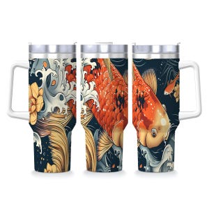 May include: Three insulated tumblers with white handles and lids. Each tumbler features a vibrant illustration of koi fish swimming in a dark blue ocean with white waves and yellow lotus flowers. The fish are orange and white.
