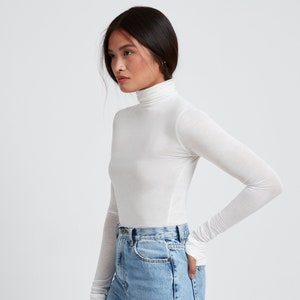Sheer white turtleneck top