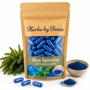 May include: A brown stand-up pouch labelled Herbs by Sonja containing 60 blue spirulina capsules at 500 mg each. The label features the text Blue Spirulina (25% phycocyanin) and a Swedish flag. Three loose blue capsules sit in front of the pouch.