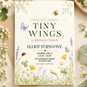 May include: A rectangular birthday invitation card featuring watercolor illustrations of a blue butterfly, a bee, a ladybug, and a caterpillar amidst wildflowers and clover. The text reads: FLUTTER BUZZ CELEBRATE TINY WINGS & BIRTHDAY THINGS ELLIOT TURNS FIVE SATURDAY, JUNE 13 2:00 PM - 4:00 PM THE GLASSHOUSE GARDEN 18 CLOVER LANE RSVP TO MAMA 416 555 0186.
