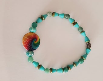 Stretch Bracelet in Turquoise beads with multi-color center bead