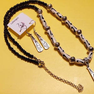 Beaded Necklace with silver drops with Native Designs and Native Beads.  Matching earrings included.