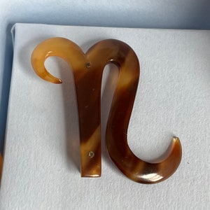 Vintage N initial pin in faux tortoiseshell
