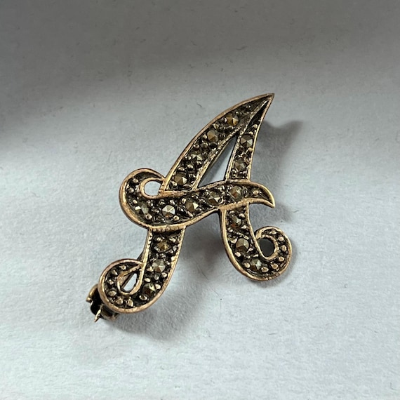 A initial vintage monogram pin