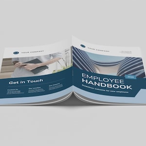 May include: An open employee handbook with a blue and white design. The cover reads "Employee Handbook" with the year 2018. The left page says "Get in Touch". The handbook is on a light grey surface.