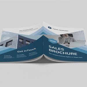Pode incluir: Um folheto azul e cinza com o texto "Sales Brochure" e "Your company business tagline or slogan here". O folheto tamb&eacute;m apresenta uma foto de uma pessoa trabalhando em um laptop.