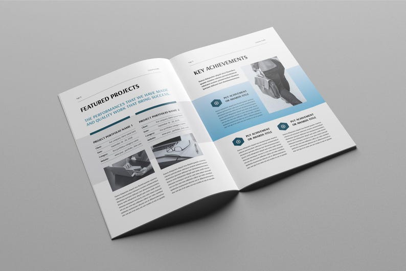 May include: Open brochure on a grey background. The brochure is open to two pages with text and images. The left page is titled "Featured Projects" and the right page is titled "Key Achievements". The brochure has a modern design with blue accents.