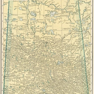 May include: A vintage map of Saskatchewan, Canada, with a grid of longitude and latitude lines. The map shows the location of cities, towns, rivers, and lakes. The map is printed in shades of brown, green, and blue on a cream-coloured background.