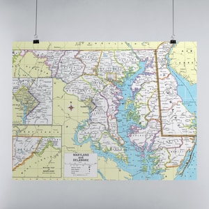 May include: A vintage map of Maryland and Delaware, showing the state borders, major cities, and counties. The map is printed on a light yellow background with blue and green accents.