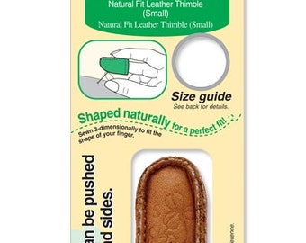 May include: A brown leather thimble with a Clover logo. The thimble is designed to fit the shape of a finger and is labeled "Natural Fit Leather Thimble Small".