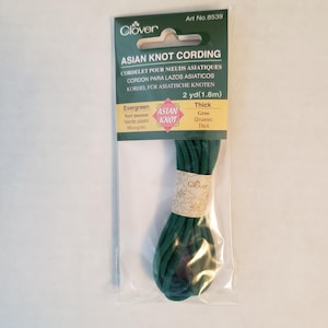 May include: A package of dark green Asian knot cording, 2 yards (1.8 meters) long. The package is labeled "Clover Asian Knot Cording" and includes the text "Art No. 8539".
