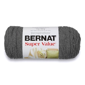 May include: A skein of Bernat Super Value yarn in a dark gray color. The label reads "7 oz/197 g Approx/Approx/Aprox 426 yds/vgs/yds/380 m Yarnspirations BERNAT Super Value™".