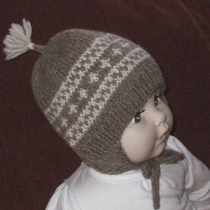 Hand knit earflap hat in a Scandinavian design and in 100 percent Organic Wool