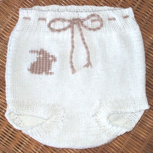 Hand knit diaper covers in 100 % white cotton with tan rabbit embroidery