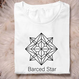 May include: A white t-shirt with a geometric black star design. The design is a symmetrical star shape with multiple points and interior geometric shapes. The text "Barced Star" is printed below the design in a sans-serif font.