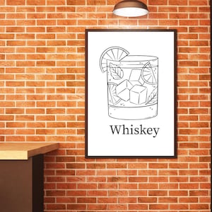 May include: Black and white illustration of a whiskey cocktail in a rocks glass, garnished with a lime slice and mint leaves. The word "Whiskey" is printed below the glass. The image is framed and hangs on a brick wall.