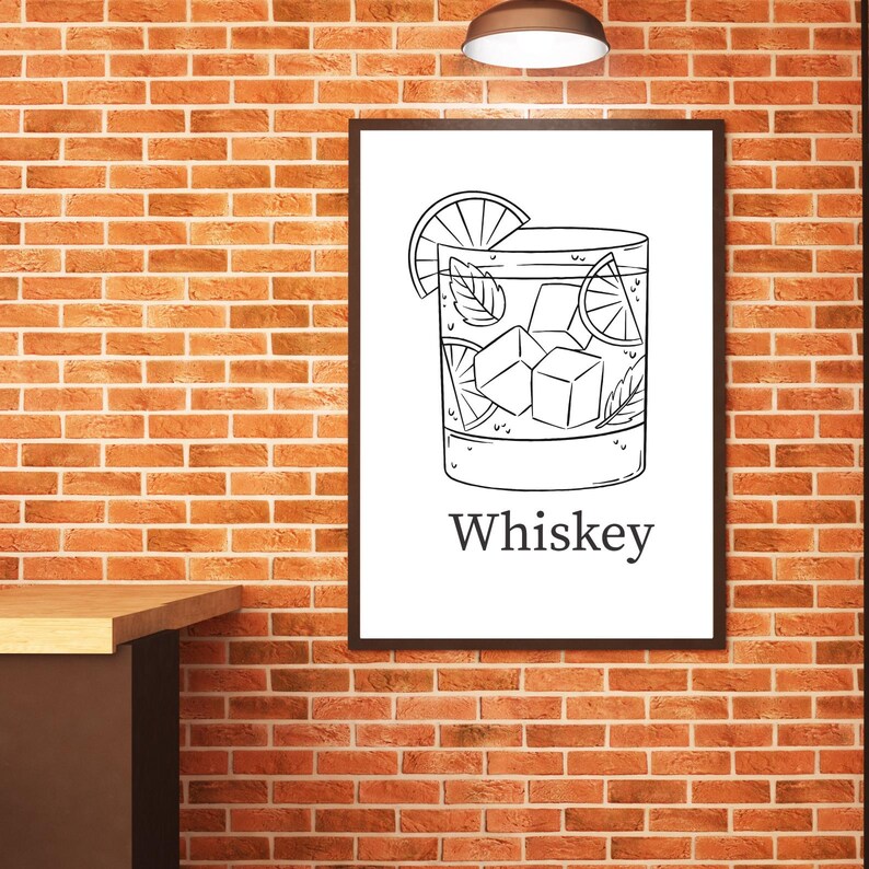 May include: Black and white illustration of a whiskey cocktail in a rocks glass, garnished with a lime slice and mint leaves. The word "Whiskey" is printed below the glass. The image is framed and hangs on a brick wall.