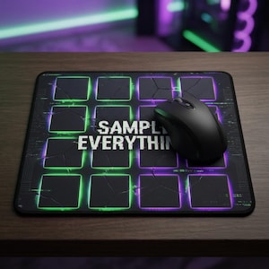 May include: Black rectangular mouse mat with a grid design, featuring neon green and purple accents. The text "SAMPLE EVERYTHING" is centered on the mat. A black wireless mouse rests on the mat, suitable for gaming or computer use.