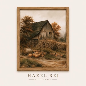 May include: A framed wall art print featuring a rustic wooden barn surrounded by autumn trees, a field of dried corn stalks, and a collection of orange pumpkins on a dirt path. The text HAZEL REI COTTAGE is printed in dark brown below the frame.