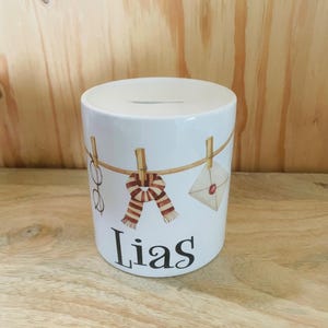 Money box personalized with magician motif.