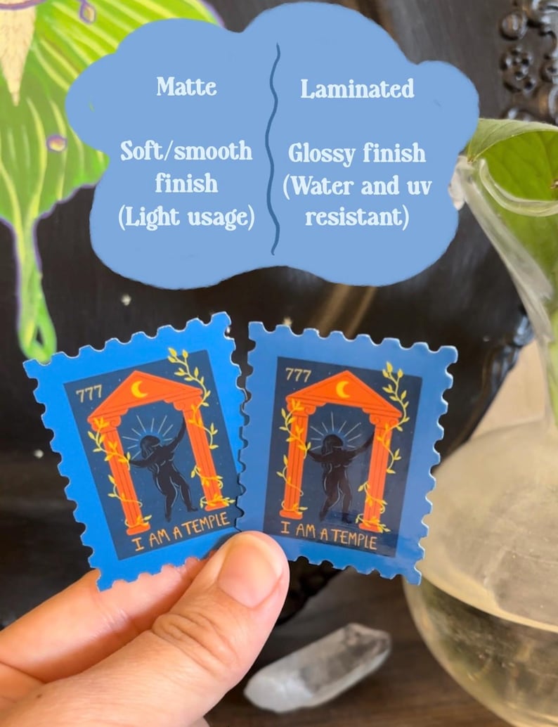 May include: Two blue stickers with a stamp design. Each sticker features a temple illustration with the text "I AM A TEMPLE". The stickers are held by a person. The image also shows text about matte and laminated finishes.