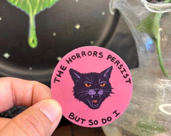 The Horrors Persist But So Do I – Gothic Black Cat Sticker, Pink Circle Resilience Sticker, Witchy Affirmation Vinyl Decal