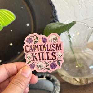 Capitalism Kills Sticker, Holographic Anti-Capitalist Vinyl Sticker, Skulls and Flowers Protest Decal, Political Laptop Water Bottle Sticker