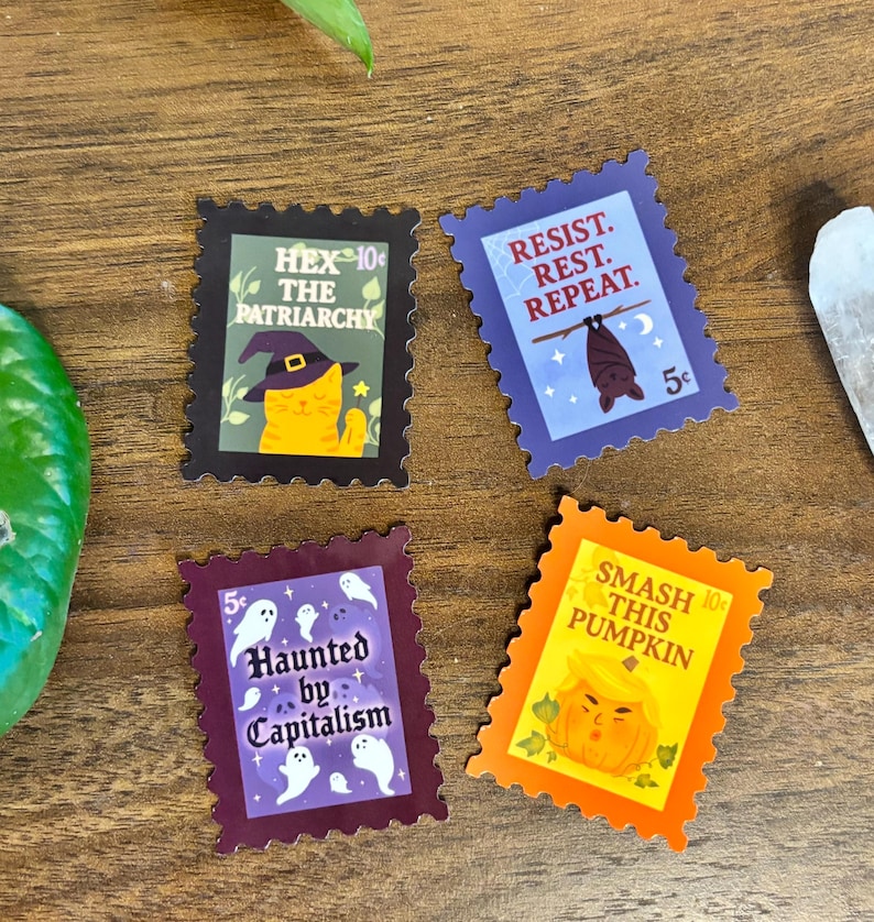 May include: Four colorful sticker designs with postage stamp edges. The stickers feature phrases like "Hex the Patriarchy," "Resist. Rest. Repeat," "Haunted by Capitalism," and "Smash This Pumpkin." Each design includes illustrations.