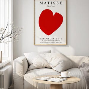 K&ouml;nnte beinhalten: Ein minimalistisches Poster mit einer roten Herzform und dem Text "MATISSE The Heart BERGGRUEN & CIE 70, RUE DE L'UNIVERSITE, PARIS-VII Da Vendredi 27 F&eacute;vrier au Samedi 28 Mars 1953"