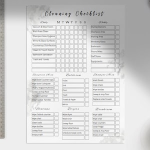May include: A printable cleaning checklist with a marble background. The checklist includes daily and weekly tasks for different areas of a salon, including the reception area, bathroom, shampoo area, stations, dryers, and breakroom.