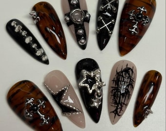 Handmade Gothic Stiletto Nails | Black and Brown Nails with Silver Cross & Star Designs | Edgy Rock Style Nails