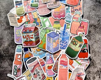 May include: A collection of colorful stickers featuring various Japanese drinks and snacks. The stickers feature illustrations of cans, bottles, and boxes of drinks and snacks, including Calpico, Yakult, Ramune, and peach juice. The stickers are perfect for adding a touch of Japanese culture to your planner, laptop, or water bottle.