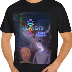 May include: A black t-shirt with a graphic print of a keyhole, a planet, and a person with a blue face. The text "THE HEAVEN'S AWAY TEAM 97" is printed on the shirt.