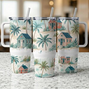 May include: Three stainless steel travel mugs with handles and straws. Each mug features a wraparound watercolor design of a tropical beach scene with palm trees, small houses, and sand. The mugs have white handles and lids.