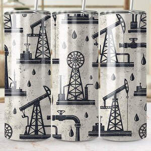 May include: Three stainless steel tumblers with a white background and black oil rig and pipeline designs. The tumblers are all the same size and shape.