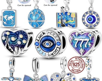May include: A collection of sterling silver charms featuring various designs including a blue passport, a globe, a starry night book, an evil eye, a heart with the number 777, a cross, a butterfly, and a moon with the text I love you to the moon and back.
