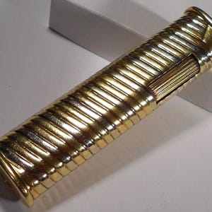 Vintage lighter with 18k solid gold outer case.