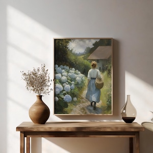 May include: A painting of a woman walking down a path lined with white hydrangeas. The woman is wearing a blue dress and carrying a basket. A small house is visible in the background.