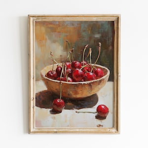 May include: A framed oil painting depicting a wooden bowl overflowing with red cherries. The cherries have green stalks and are arranged in the bowl. One cherry lies outside the bowl. The painting has a warm colour palette and a gold frame.
