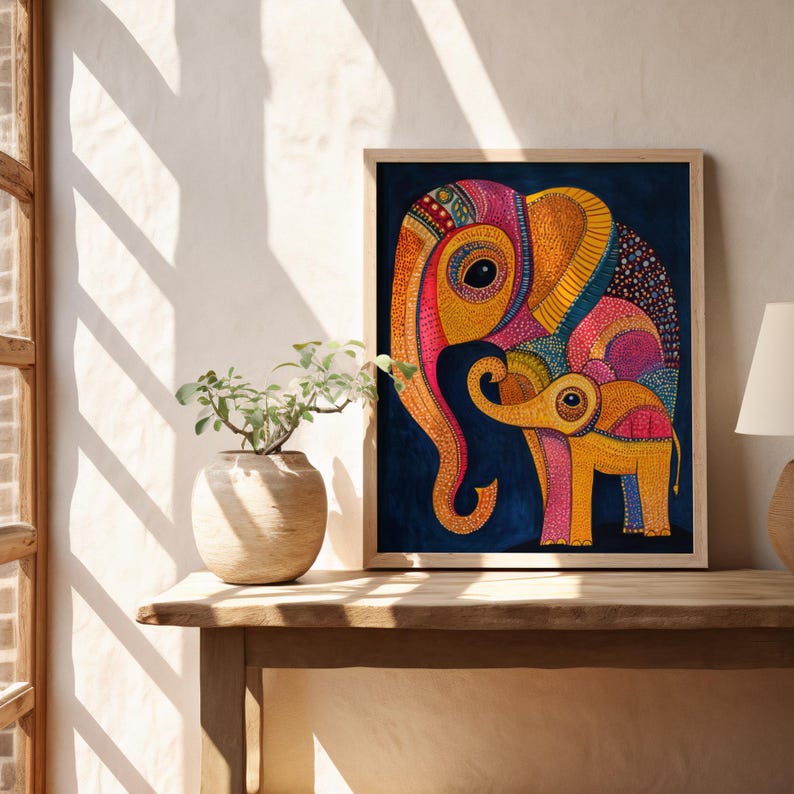 May include: A framed illustration of two elephants, one large and one small, with colorful, intricate patterns. The elephants are on a dark blue background.