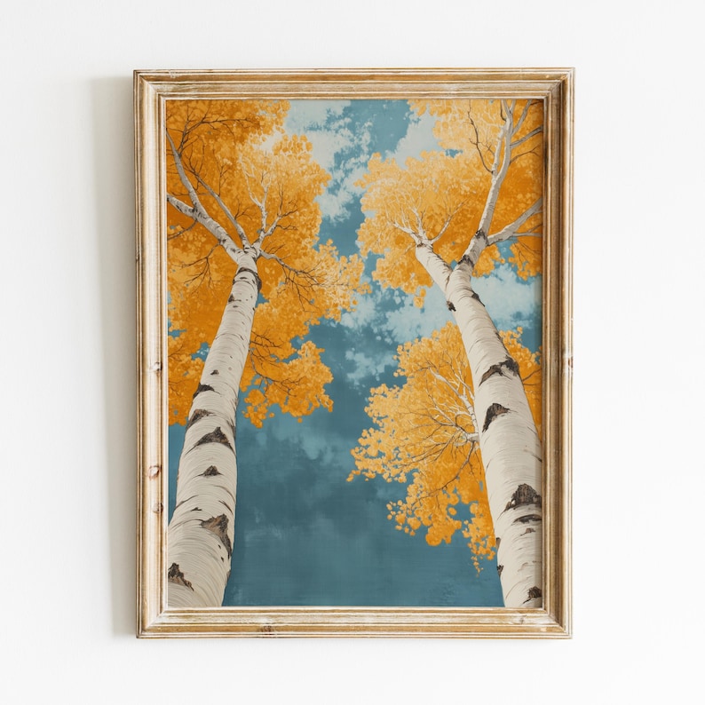 May include: A framed painting of two birch trees with yellow leaves against a blue sky. The trees are tall and slender, and their branches reach up towards the sky. The painting is in a rustic wooden frame.