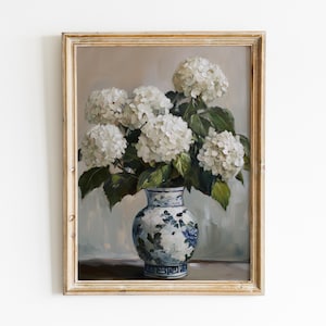 May include: A painting of a bouquet of white hydrangeas in a blue and white porcelain vase. The vase has a floral pattern and is sitting on a table.