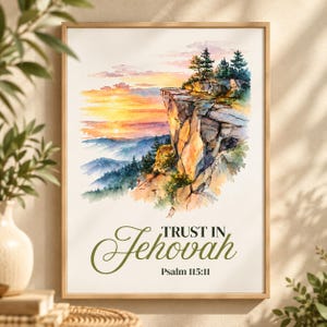 May include: A framed watercolor print featuring a rocky cliffside overlooking a mountain range at sunset. The sky displays orange and yellow hues. Below the landscape, the text reads TRUST IN Jehovah and Psalm 115:11 in dark green.
