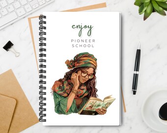 May include: Spiral-bound notebook with a white cover featuring an illustration of a person reading a book. The text "enjoy PIONEER SCHOOL" is printed in green. The illustration depicts a person wearing glasses, a headscarf, and a green top.