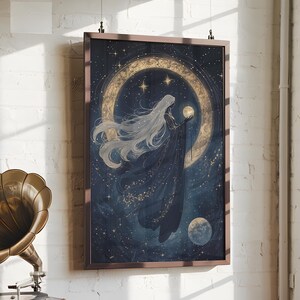 May include: A framed print of a woman with long white hair standing in front of a crescent moon. The background is a dark blue with gold stars and a small planet. The woman is wearing a dark blue dress and holding a small orb in her hand.