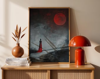 May include: An abstract painting in a wooden frame depicts a figure in a red dress under a large red moon. The artwork has a dark, moody color palette with gray and black tones. A red table lamp sits on a wooden cabinet.